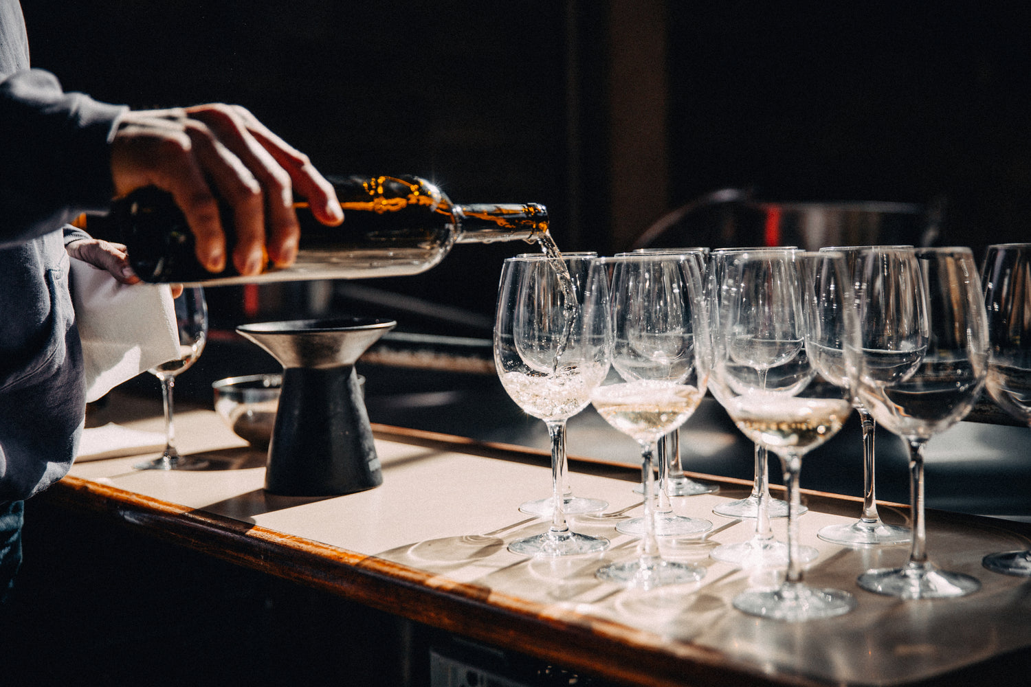 filling-wine-glasses-on-counter